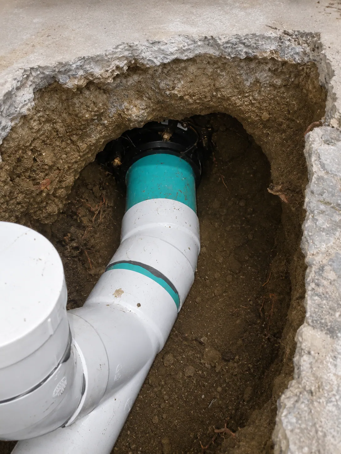 Excavated sewer line repair with a new coupling